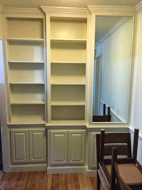 Transitional Library with white painted cabinets