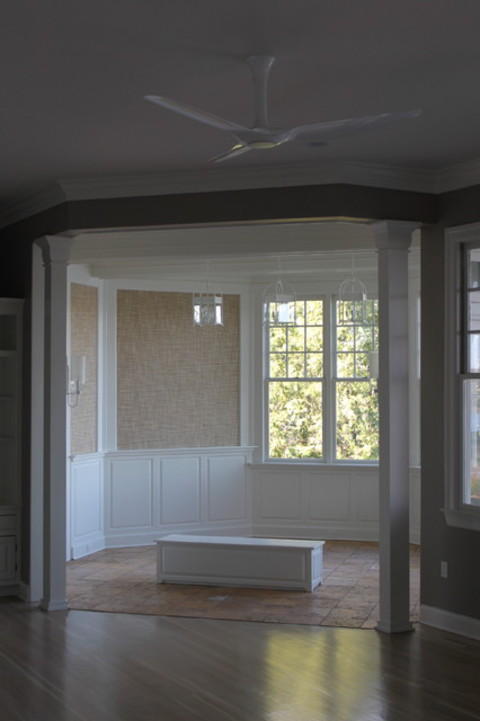 Transitional Sunroom with natural stone floor