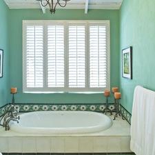 Eclectic Bathroom with white plantation shutters