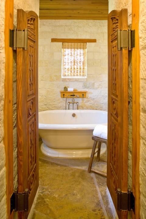 Eclectic Bathroom with beautifully decorated wooden doors
