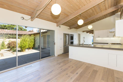 Contemporary Dining Room with stainless steel appliances