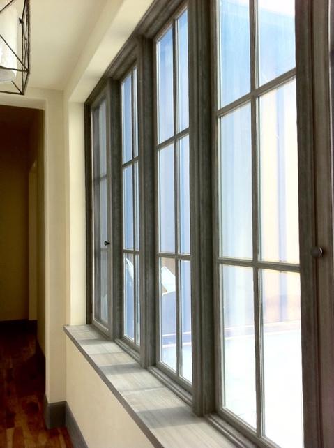 Transitional Sunroom with hand hewn hickory floor