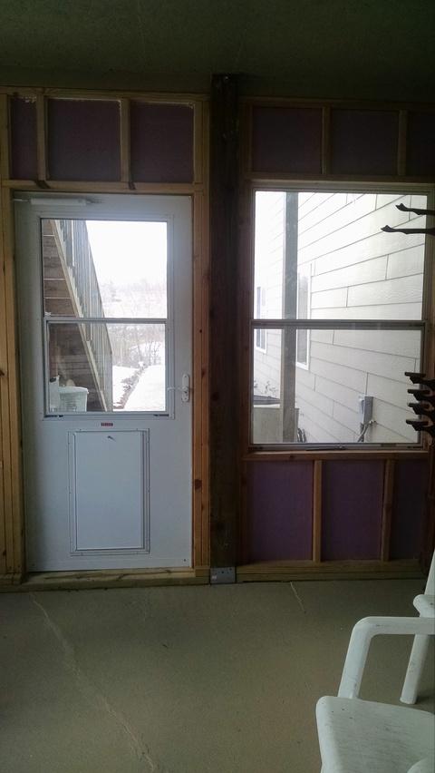 Traditional Sunroom with white storm door