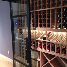 Contemporary Wine Cellar with glass sidelight panel