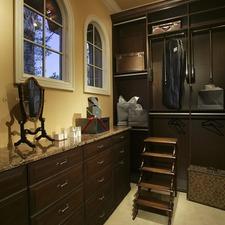 Traditional Closet with beige granite countertops