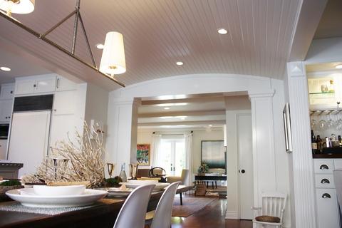 Modern Dining Room with cabinet paneled refrigerator