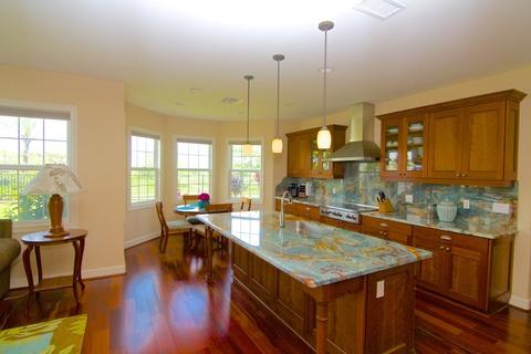 Eclectic Kitchen with solid surface backsplash