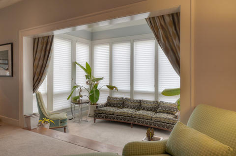 Contemporary Sunroom with patterned four cushion sofa