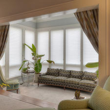 Contemporary Sunroom with patterned four cushion sofa