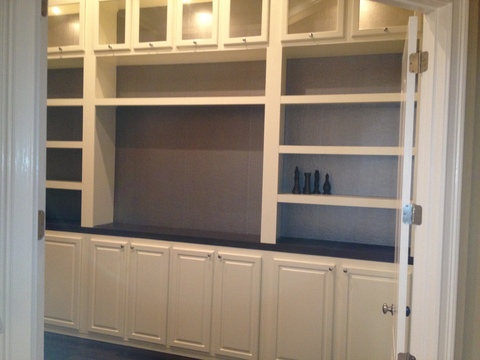 Transitional Library with glass front upper cabinets