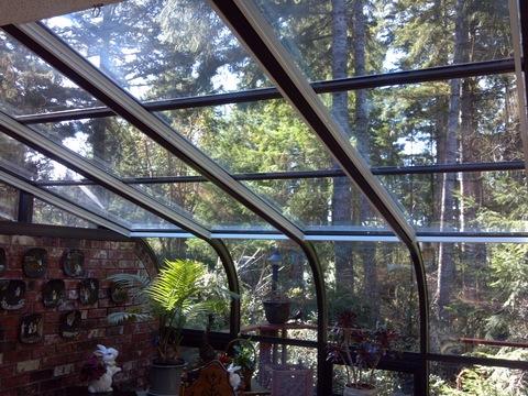 Transitional Sunroom with exposed brick wall