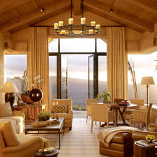 Traditional Living Room with custom window treatment