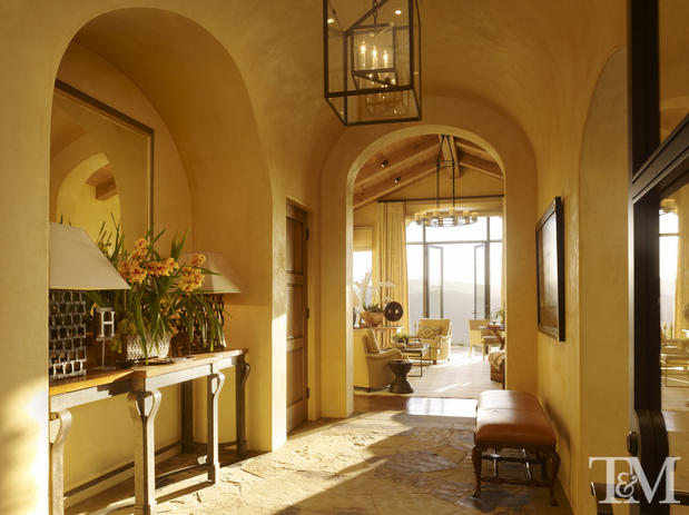 French Country Hallway with rustic yellow walls
