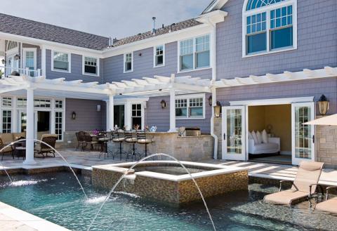 Traditional Pool with black metal outdoor patio furniture