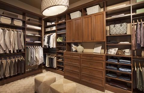 Traditional Closet with traditional style master bedroom closet with built in cabinetry