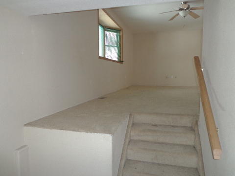 Transitional Bedroom with ceiling fan and light