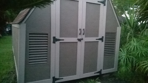 Transitional Garage with asphalt shingle roof