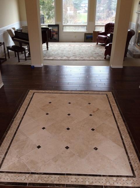 Traditional Entry with inlaid tile floor