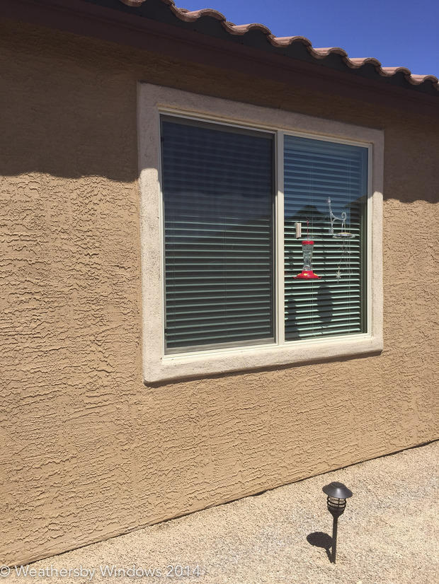 Southwestern Home Exterior in Tucson stucco window trim, red clay tile roof by Weathersby