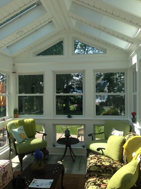 Traditional Sunroom with chartreuse chair and throw pillows