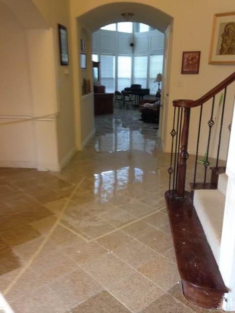 Tuscan Entry with darkly stained hardwood staircase