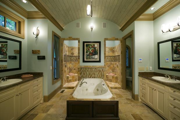 Traditional Master Bathroom with dark wood bath surround