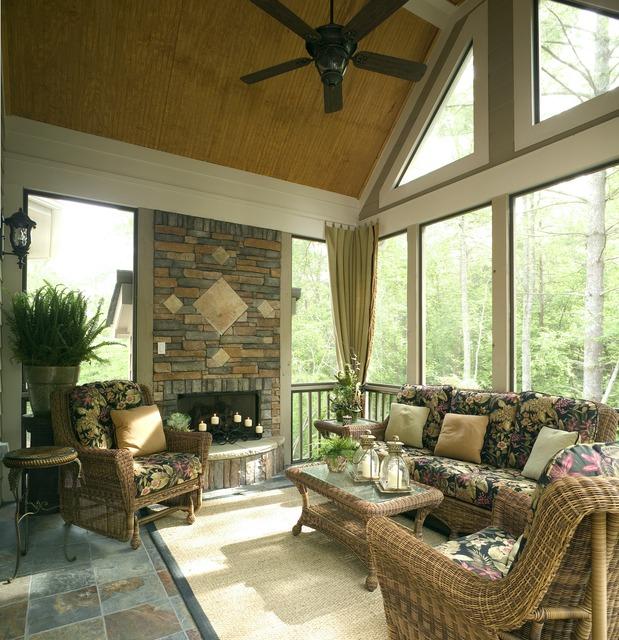 Traditional Sunroom Photo - stone, round wicker end table ...