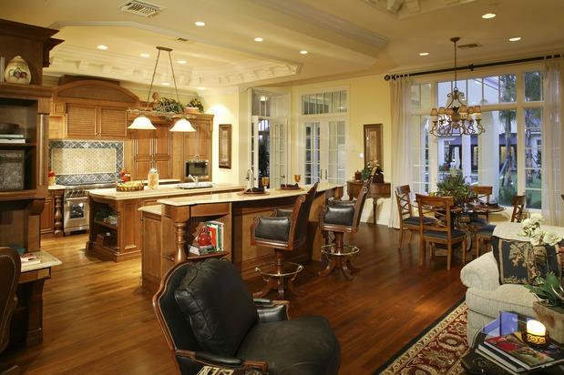 Traditional Family Room with pale yellow painted walls