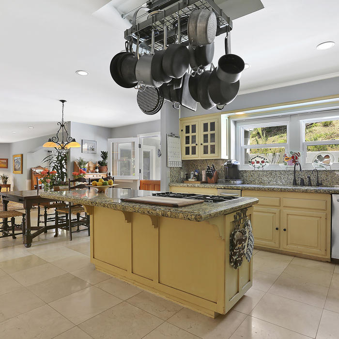 Pots and Pans Hanging Over Kitchen Island