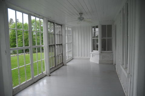 Eclectic Sunroom with white vertical panel walls