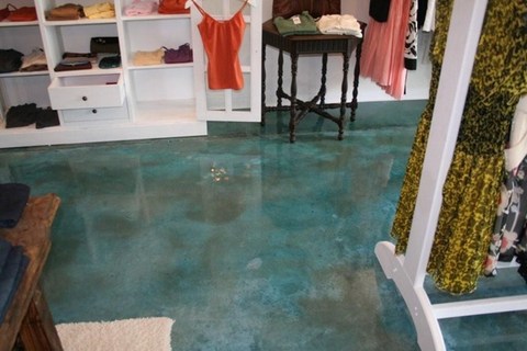 Eclectic Closet with tinted concrete floor