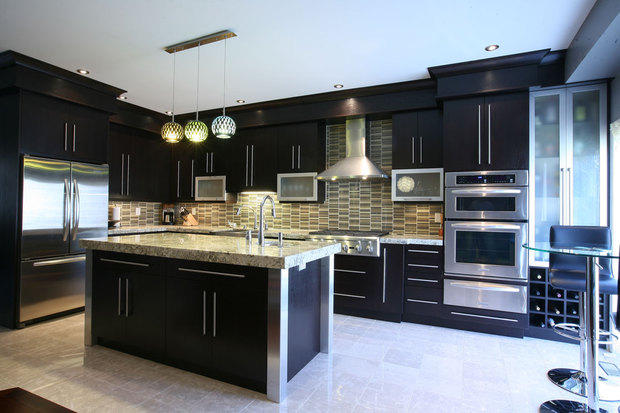 Modern Kitchen with varied color hanging pendants