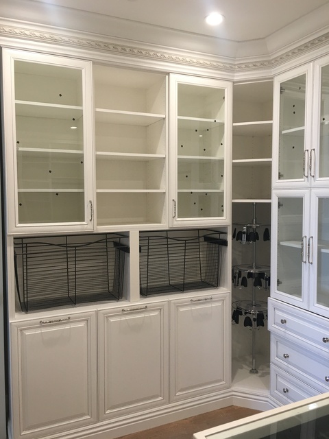 Traditional Closet with glass top accessorie island