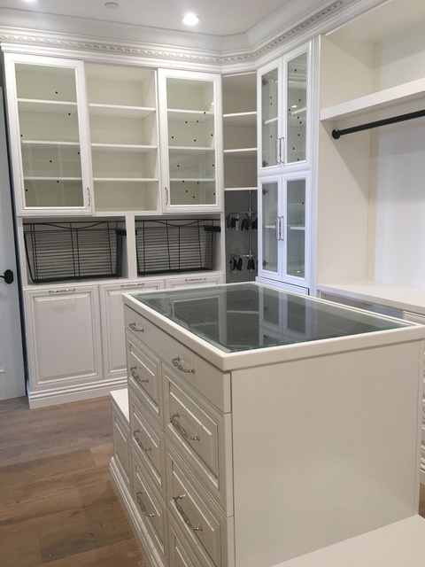 Traditional Closet with glass top jewelry closet island