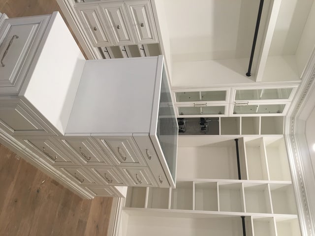Traditional Closet with white built in closet organizers