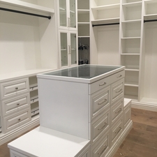 Traditional Closet with white built in closet organizers