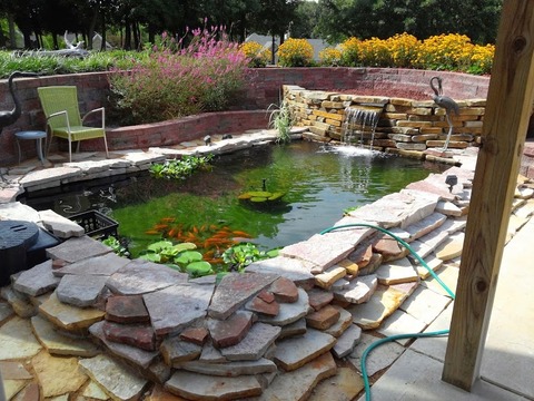 Eclectic Landscape with brick retaining wall