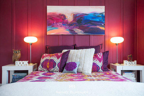 Eclectic Bedroom with pink and white pillows