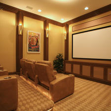 Traditional Home Theater with brown leather theater seating