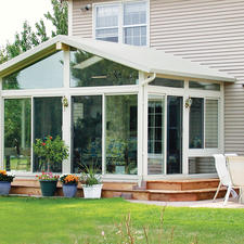 Traditional Sunroom with sliding glass doors