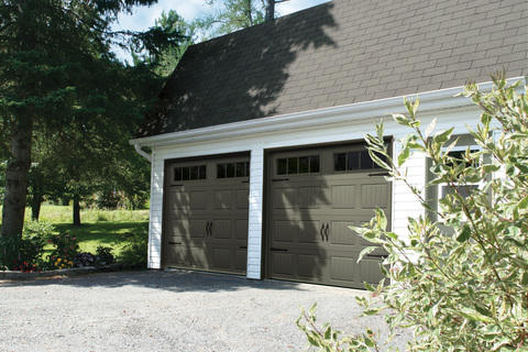 Transitional Garage with carriage house garage doors
