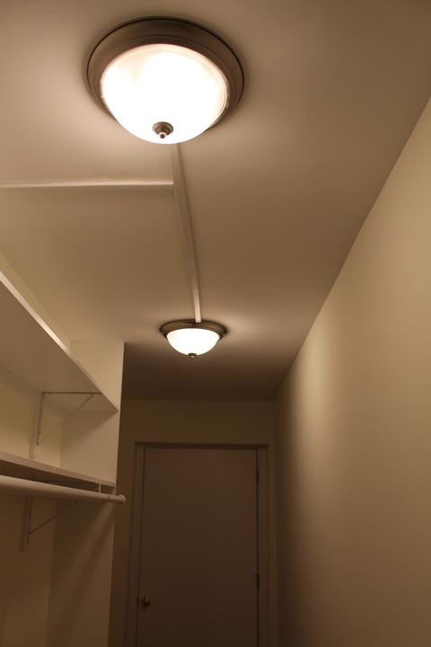 Traditional Closet with off white walls