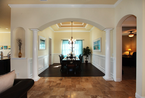 Transitional Dining Room with creamy yellow walls