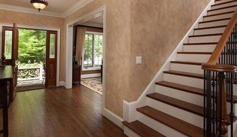 Traditional Entry with medium wood banister rails