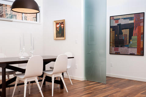 Eclectic Dining Room with gold framed abstract wall art