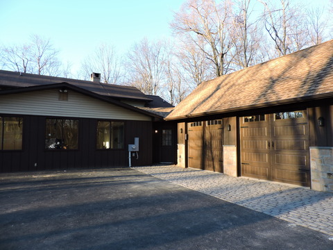 Transitional Garage with windowed exterior door