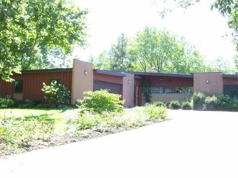 Mid-Century Modern Home Exterior with dark gray exterior trim