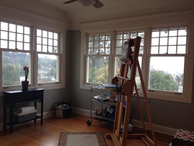 Casual / Comfortable Craft Room with medium wood floor