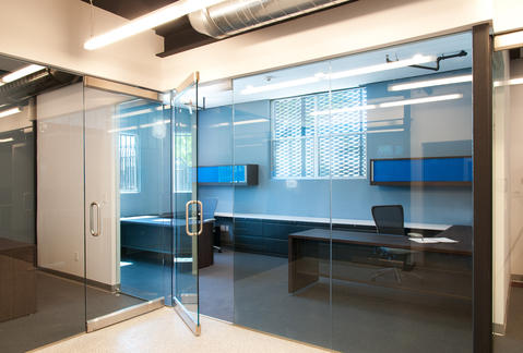 Contemporary Home Office with frameless glass office doors