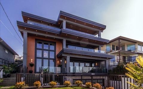 Modern Home Exterior with glass and steel porch railing